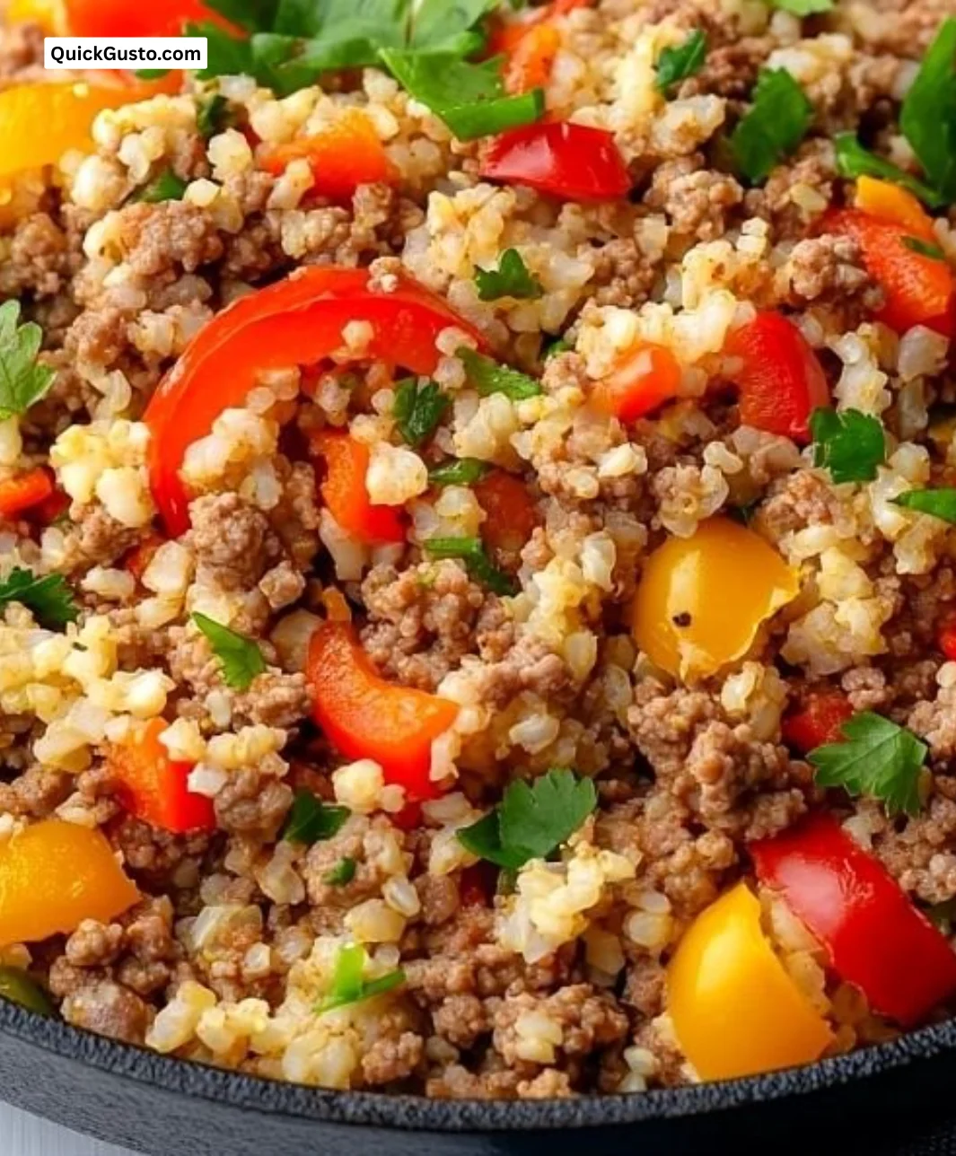 Homemade cauliflower rice served with ground beef in a cozy kitchen setting.