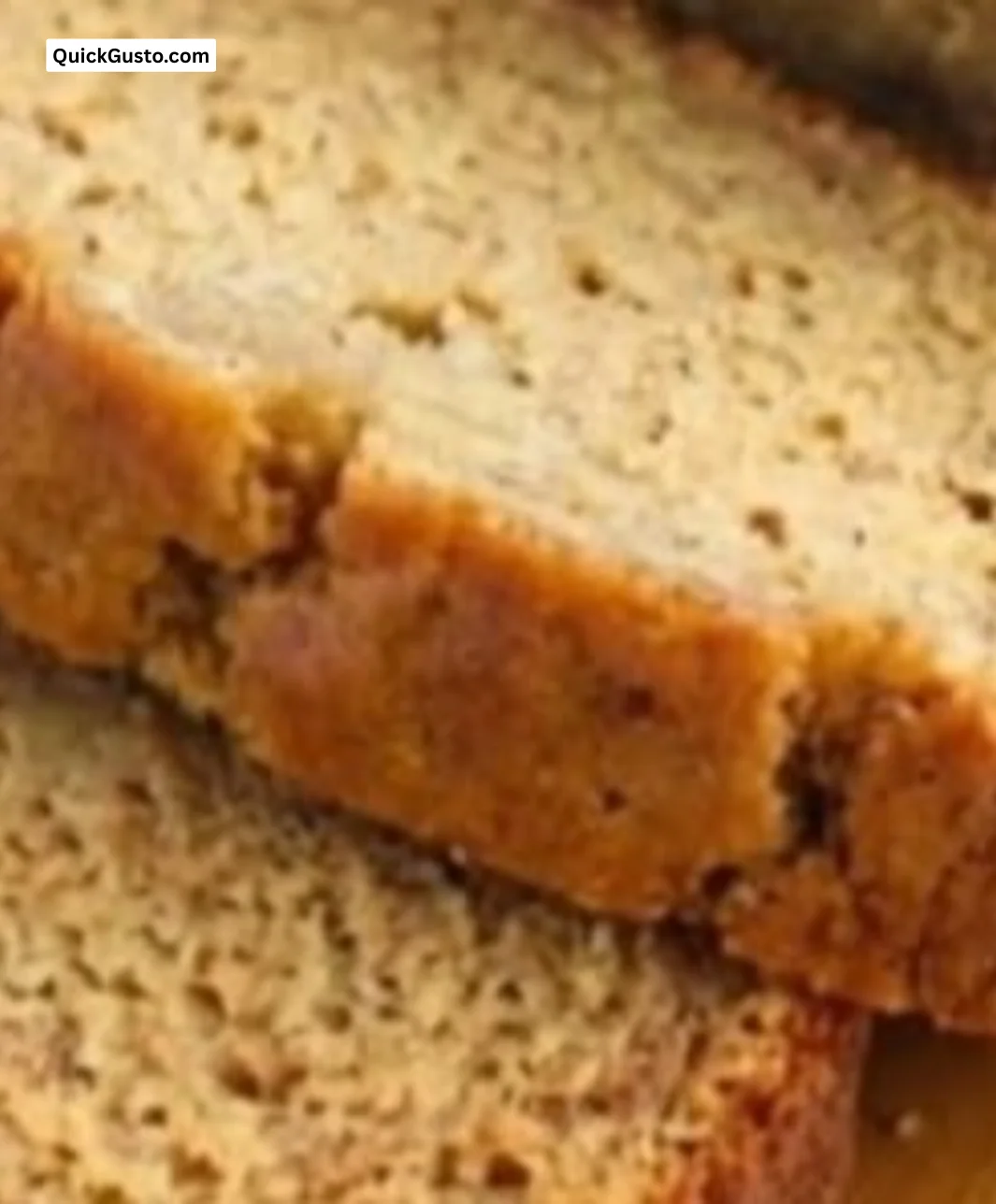 Loaf of sugar-free banana bread on a wooden cutting board