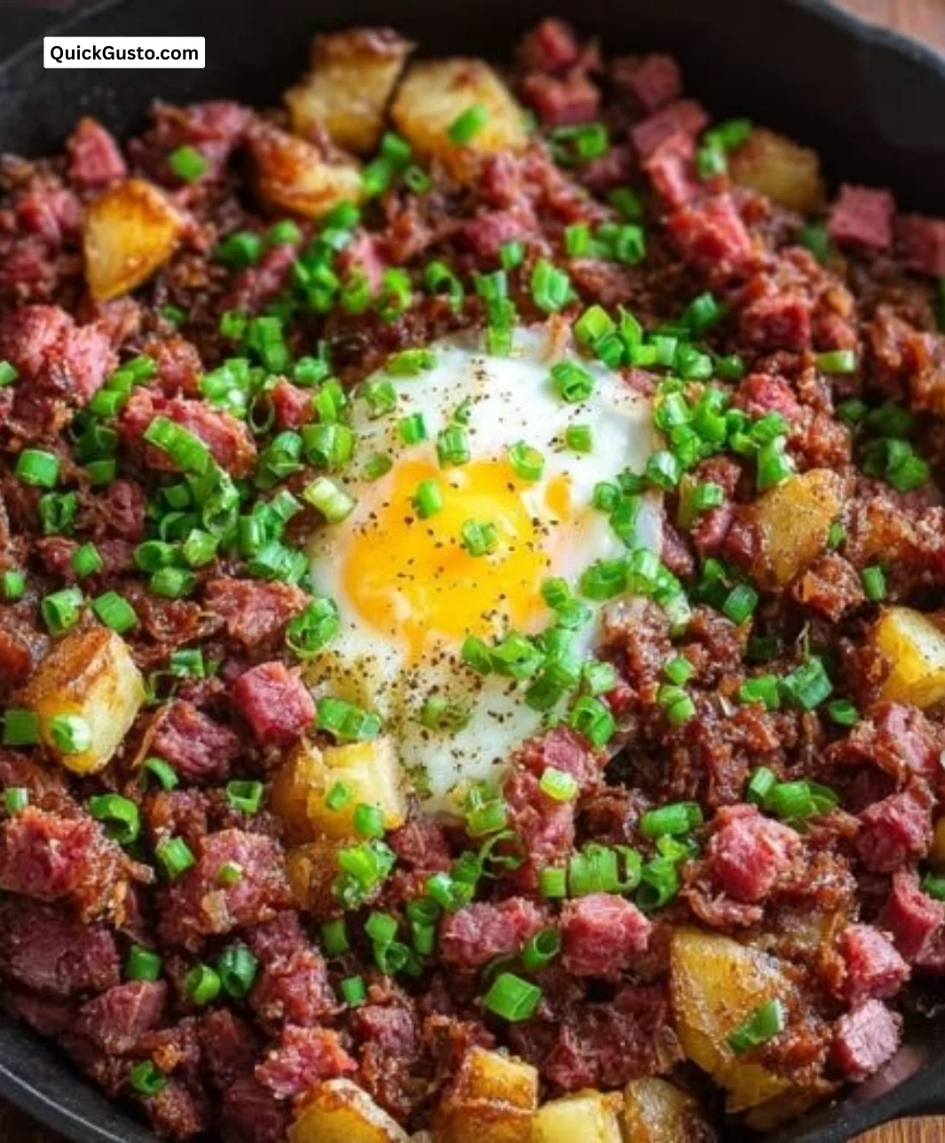 A plate of homemade corned beef hash served with eggs on a Sunday morning.