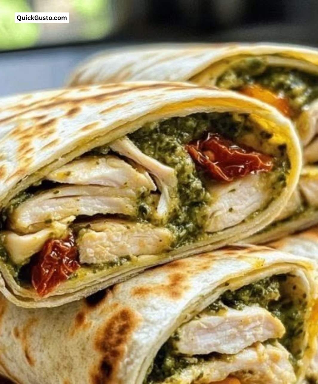 Sunlit chicken pesto wraps served on a plate, perfect for weeknight dinners.