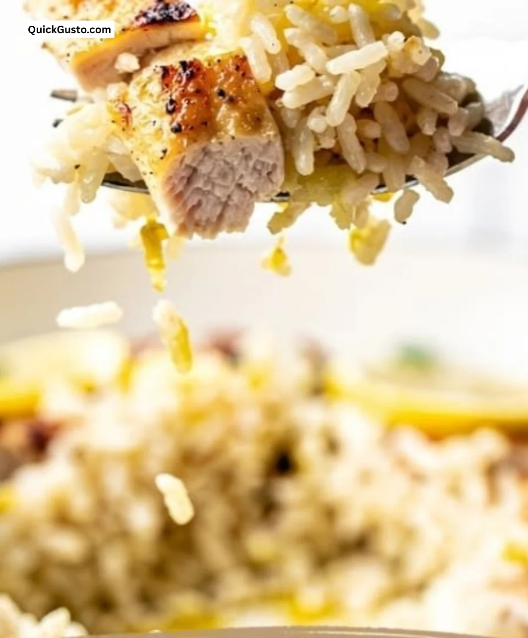 One-pan lemon chicken and rice served in a skillet with fresh herbs