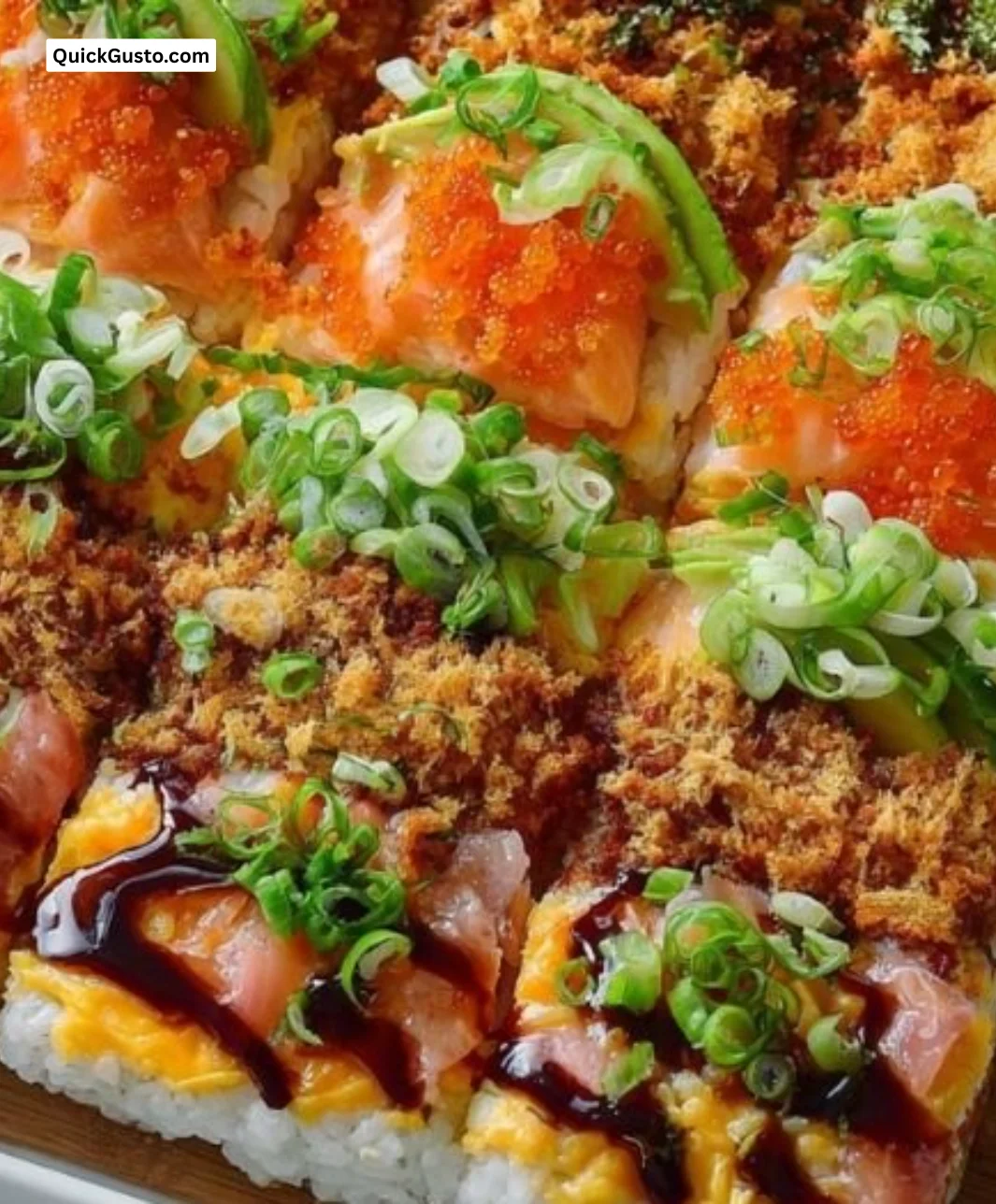 Delicious baked sushi dish garnished with fresh ingredients.