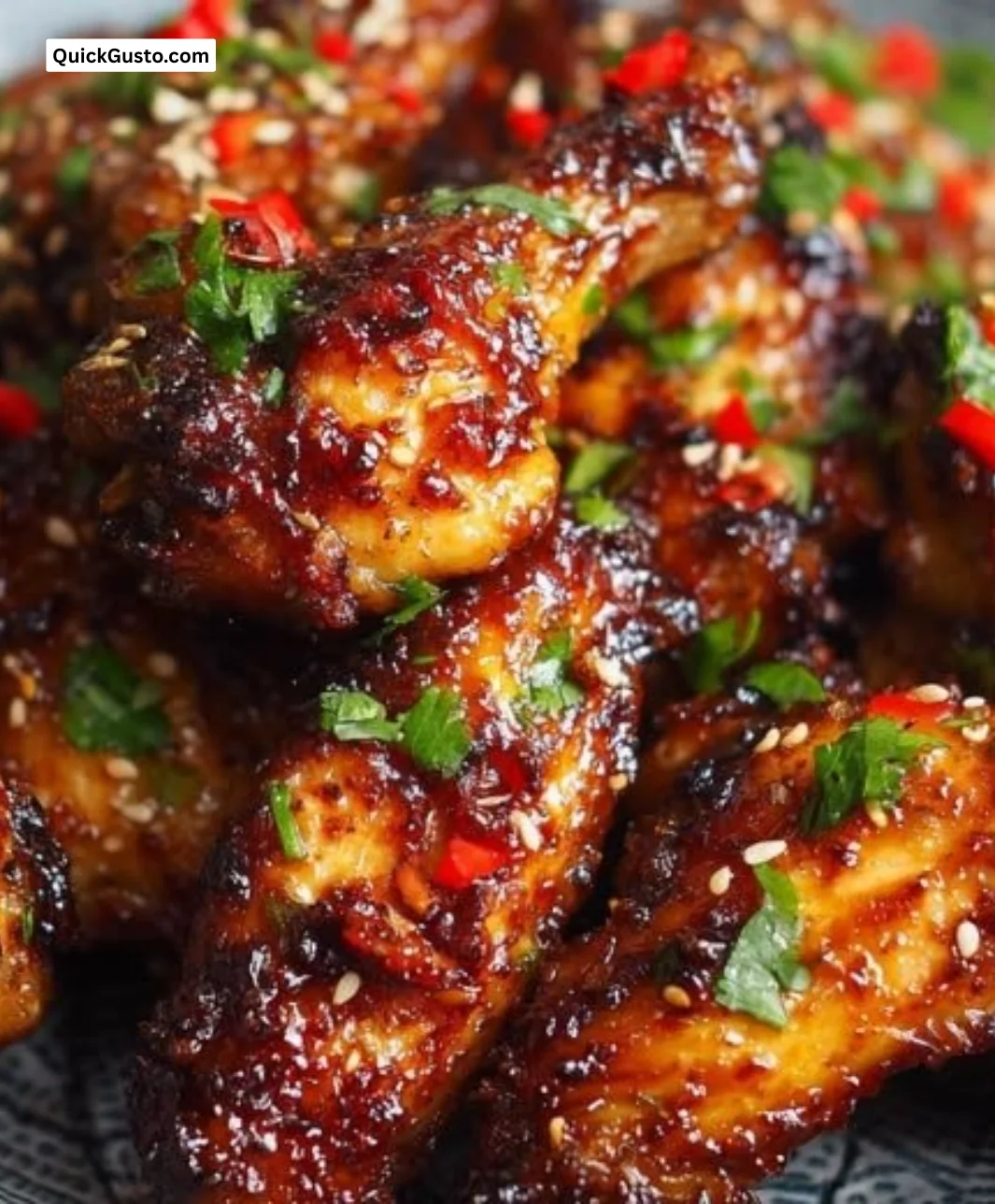 Delicious sweet and spicy chicken wings arranged on a rustic platter