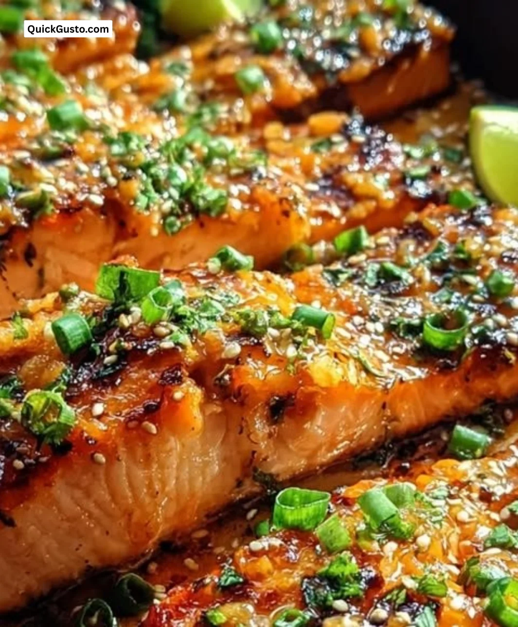 Plate of Bang Bang Salmon garnished with green onions and served with rice