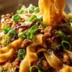 Delicious Beef Potsticker Noodle Bowl garnished with fresh vegetables