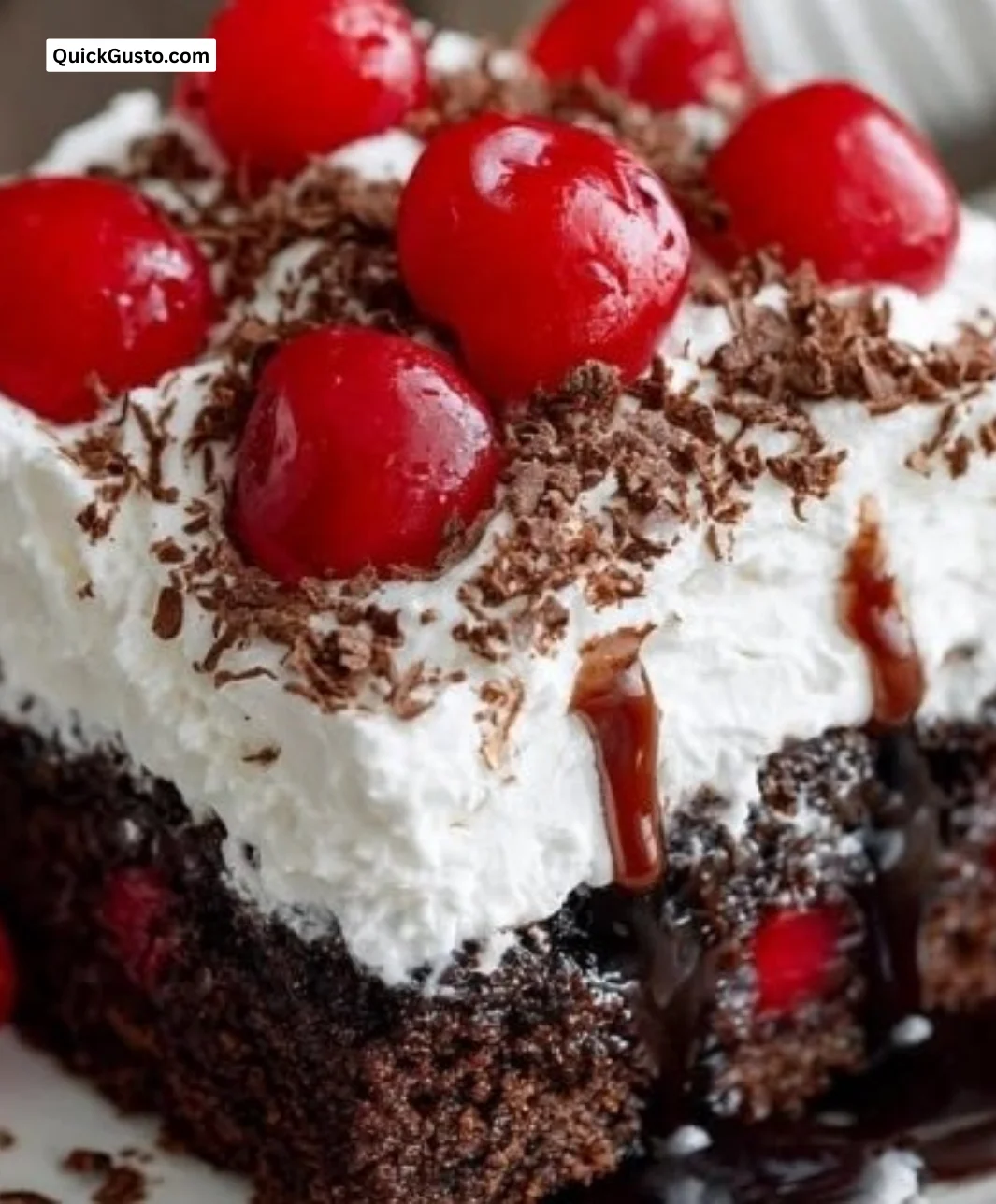 Delicious Black Forest Poke Cake with chocolate and cherry topping.