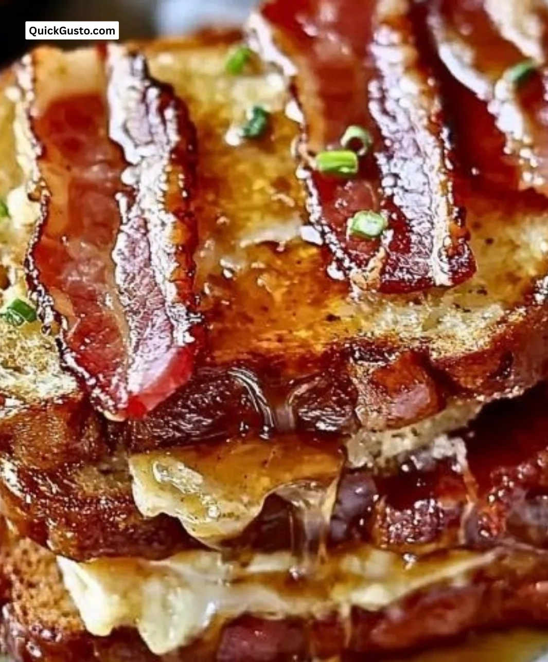 Bourbon Maple Bacon Breakfast Toast topped with crispy bacon and maple syrup