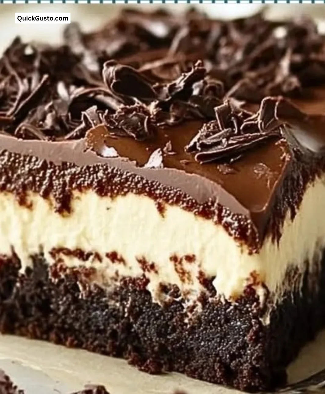 Delicious Brownie Bottom Cheesecake Dessert topped with chocolate and berries