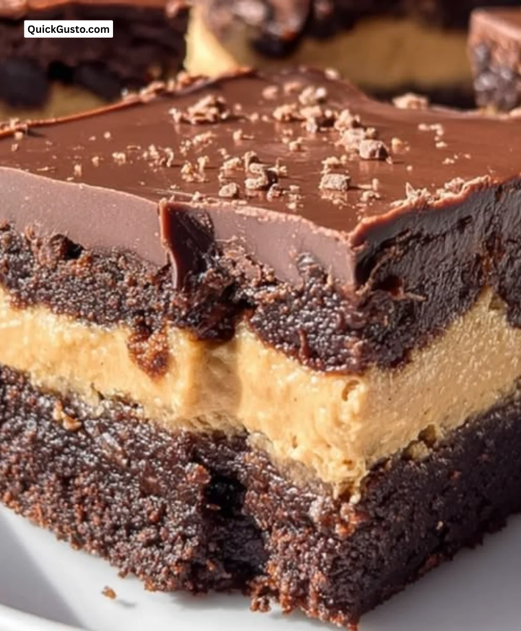 Delicious homemade Buckeye Brownies with peanut butter and chocolate topping.