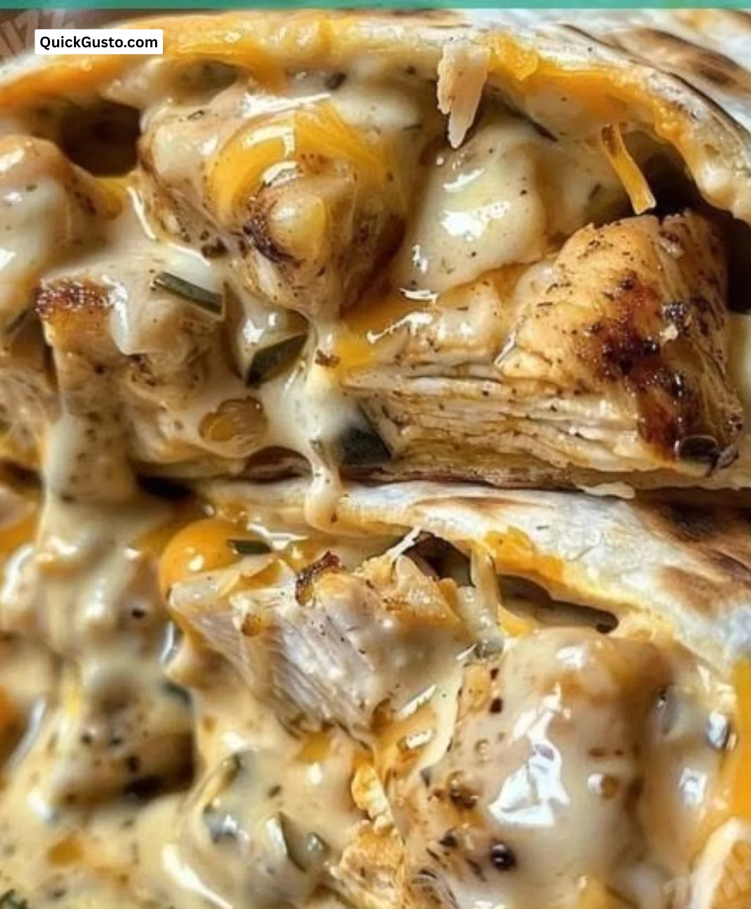 Cheesy garlic chicken wraps filled with succulent chicken and melted cheese.