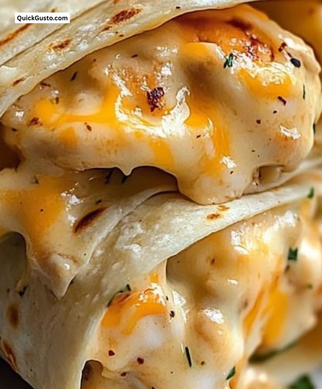 Cheesy garlic chicken wraps filled with tender chicken and melted cheese