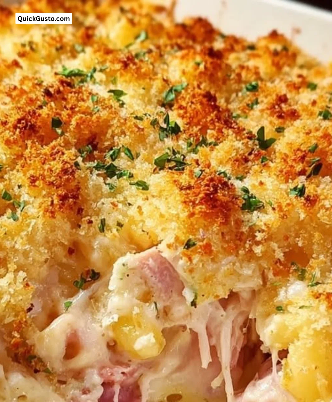 Delicious Chicken Cordon Bleu Casserole topped with cheese and herbs