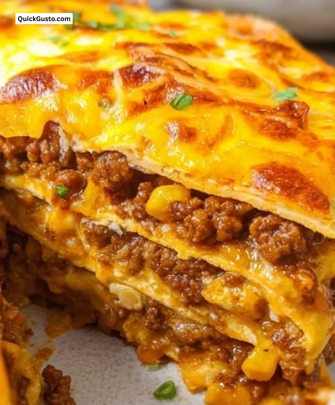 Cozy cheesy layered taco bake ready to serve for a comforting weeknight dinner
