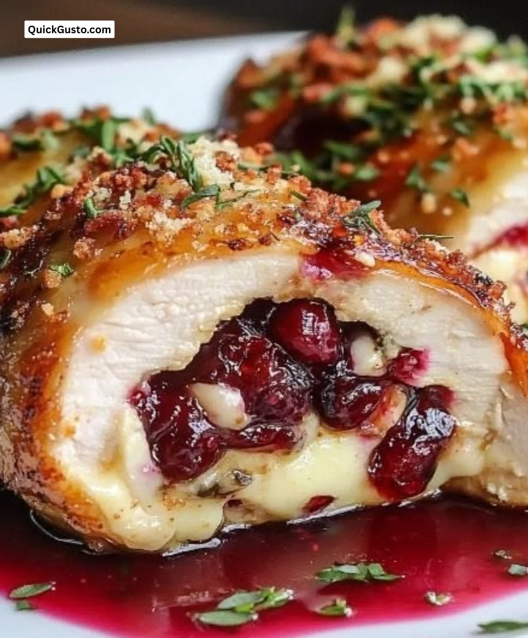 Cranberry Brie Stuffed Chicken with melted cheese and cranberries