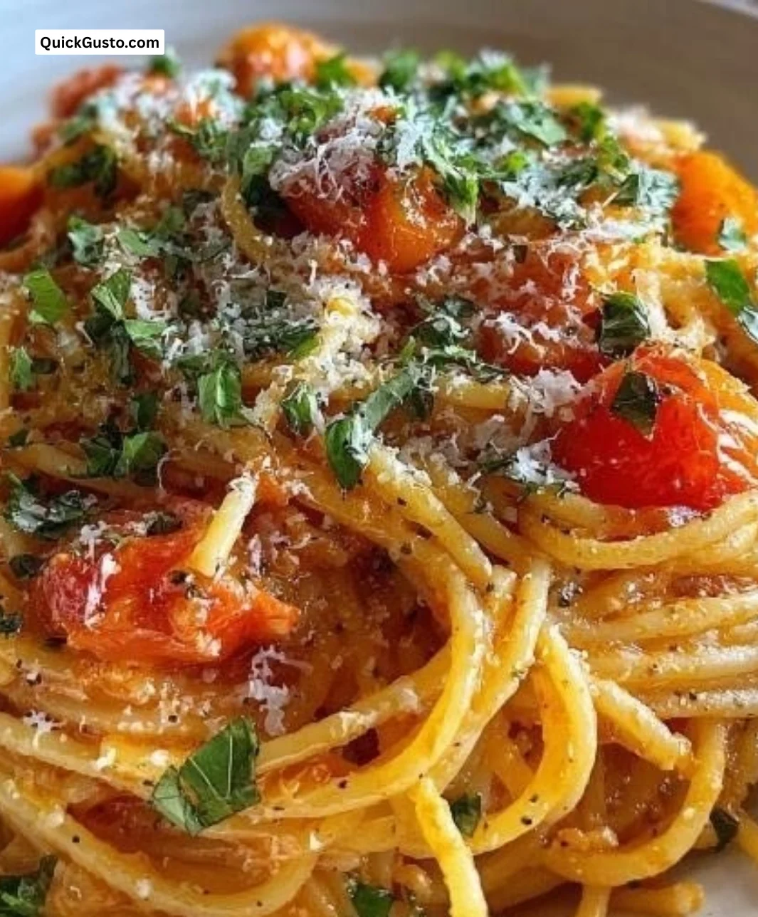 Creamy fresh tomato garlic pasta served in a bowl garnished with basil