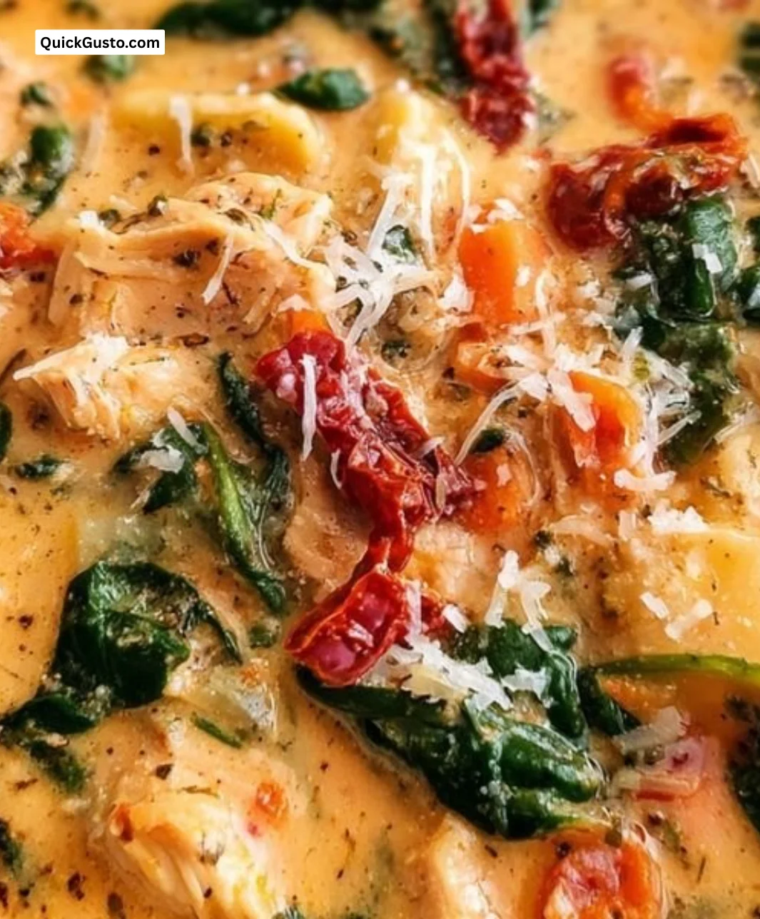 Bowl of creamy Marry Me Tuscan chicken soup garnished with fresh herbs