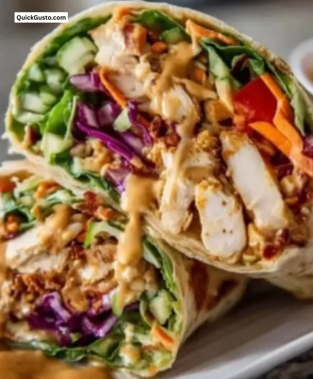 Thai Peanut Chicken Wraps with fresh vegetables and creamy peanut sauce