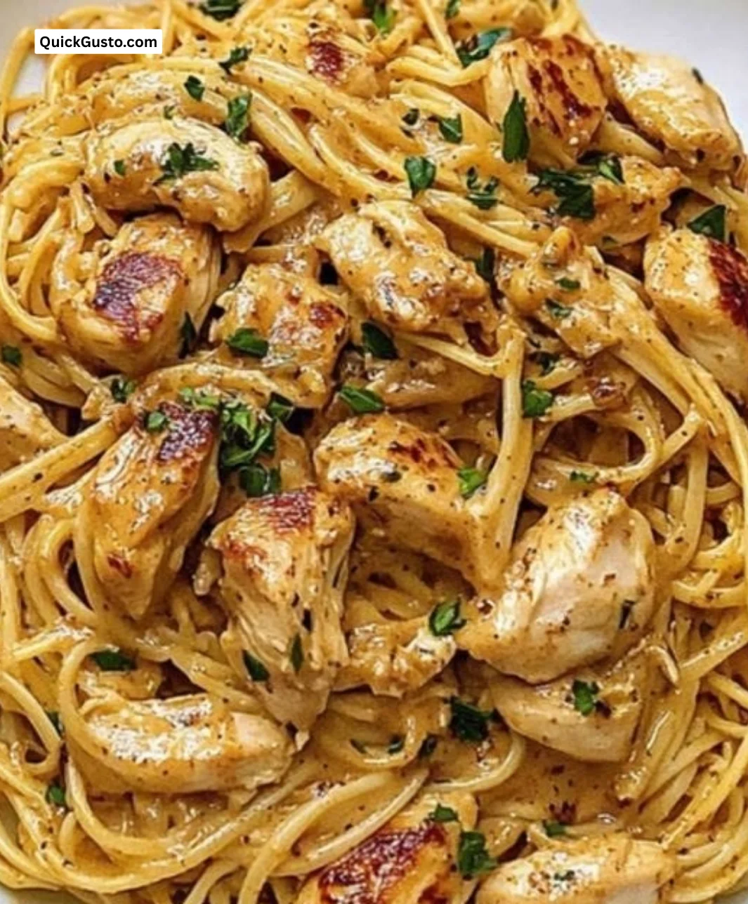 Fast chicken linguine with garlic butter and chili seasoning served in a bowl