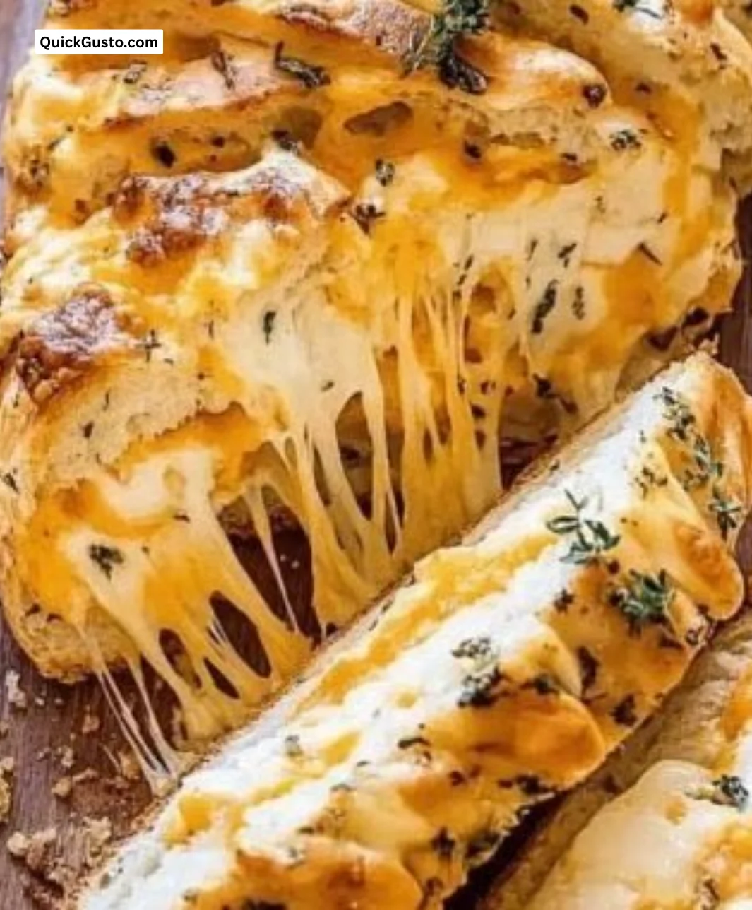 Delicious Garlic Herb Cheddar Cheese Bread with herbs and melted cheese