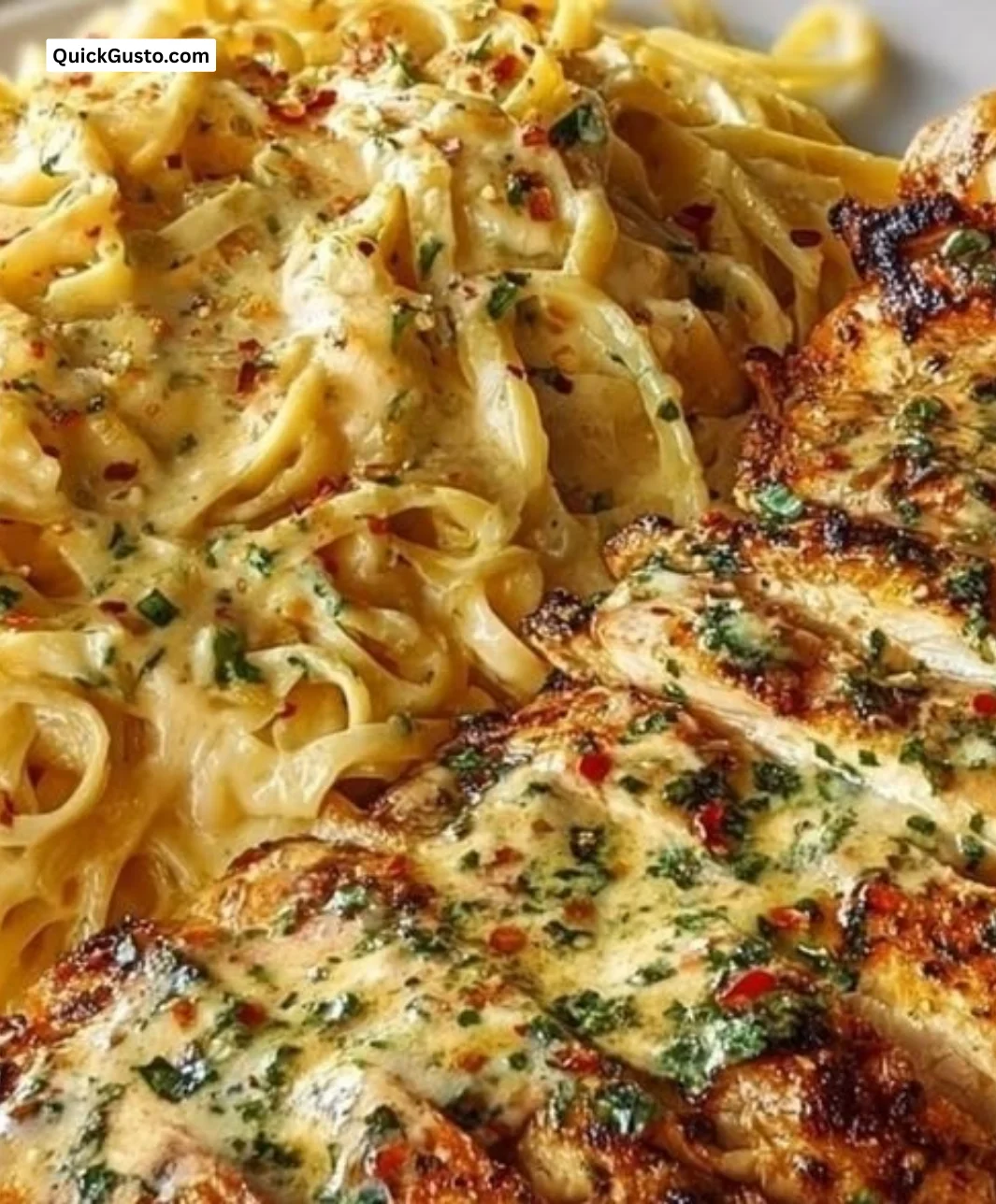 A bowl of Garlic Parmesan Chicken Spaghetti with Spicy Cajun Cream Sauce.