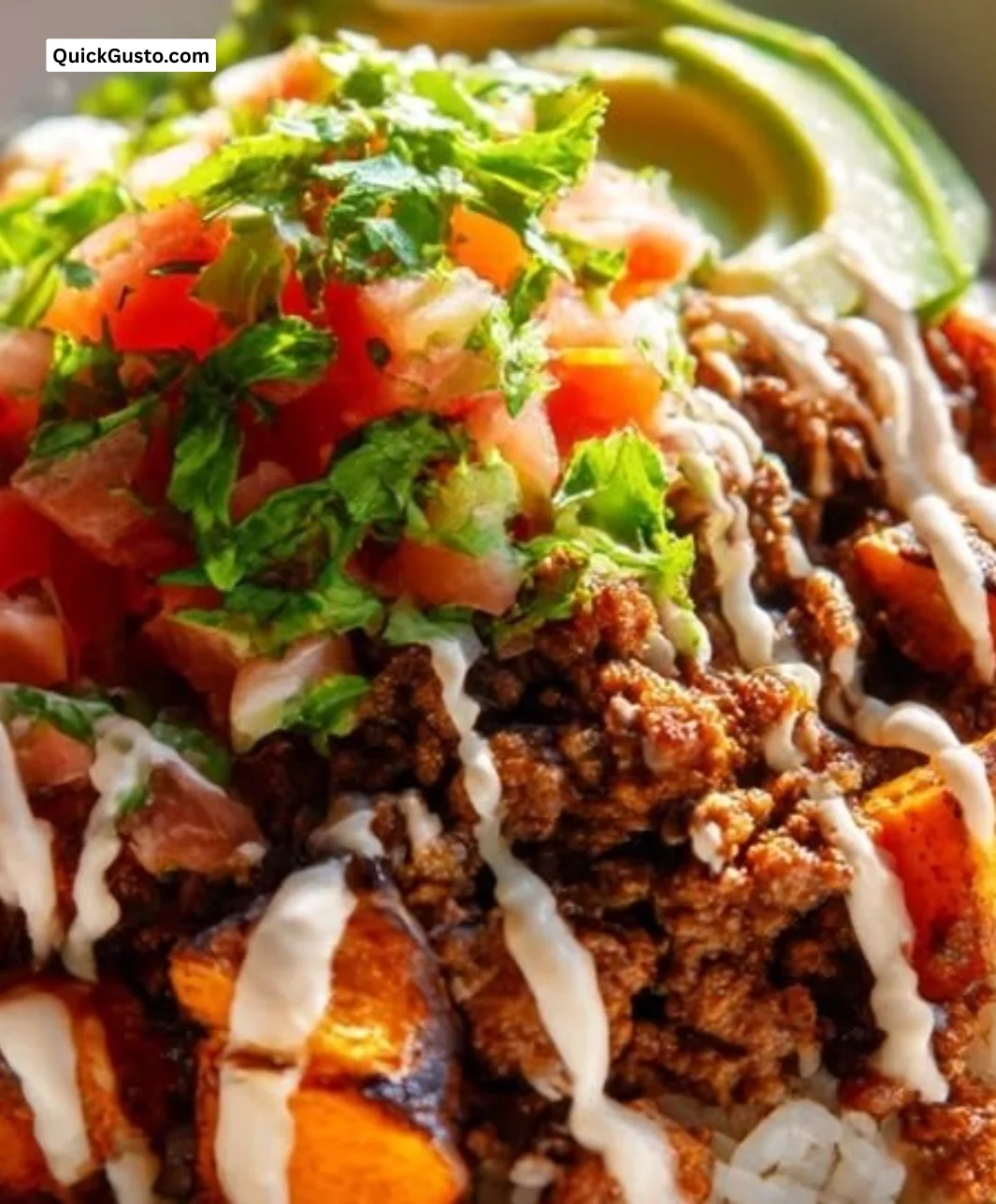 Ground beef and sweet potato taco bowls with lime crema for a cozy dinner.