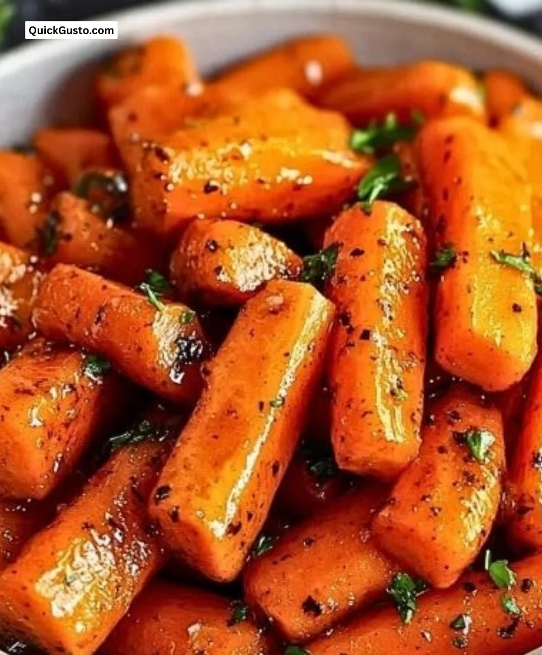 Quick honey glazed carrots on a plate, a bright and tasty side dish.
