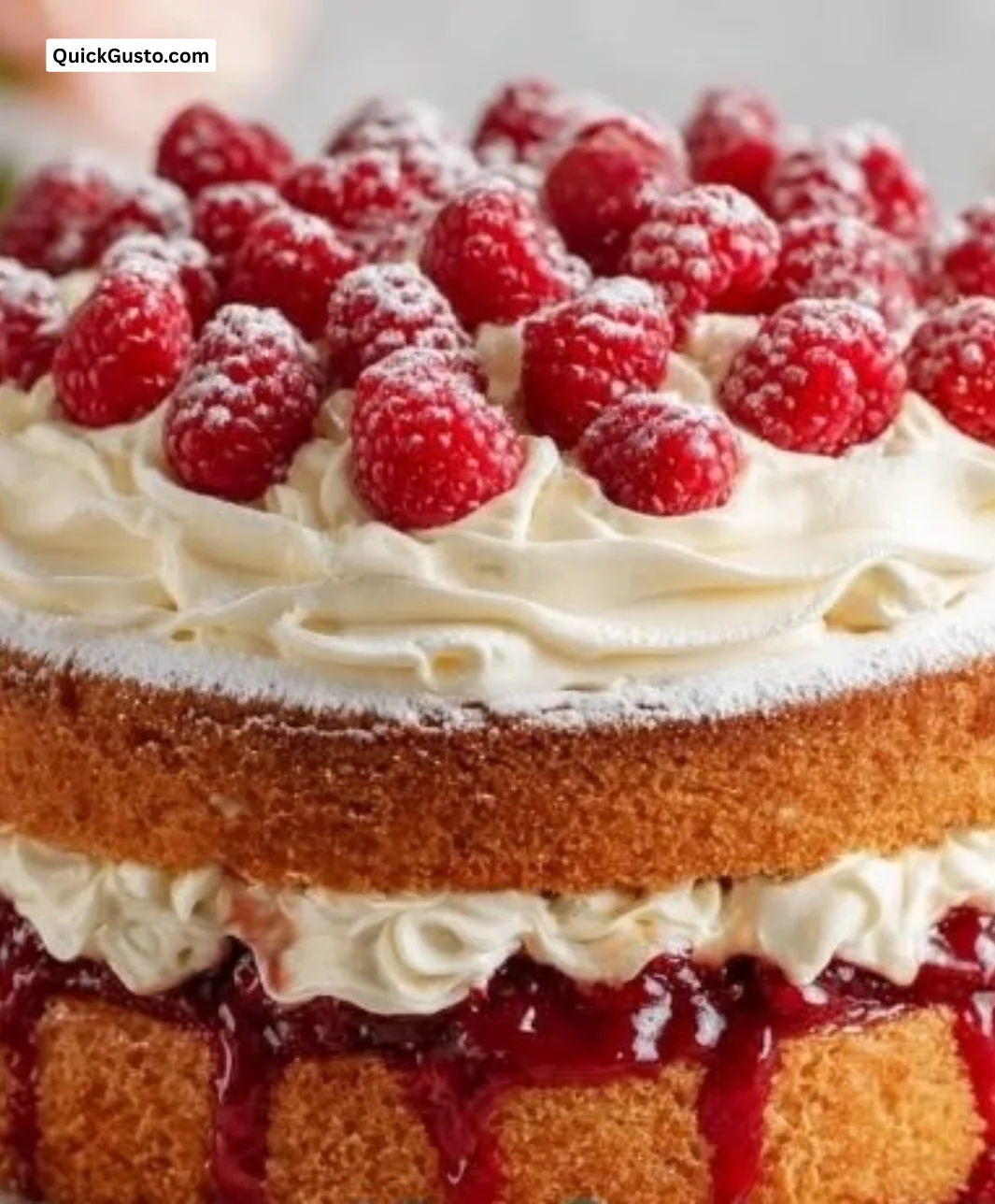 Honey Raspberry Cake dessert showcasing a slice topped with fresh raspberries