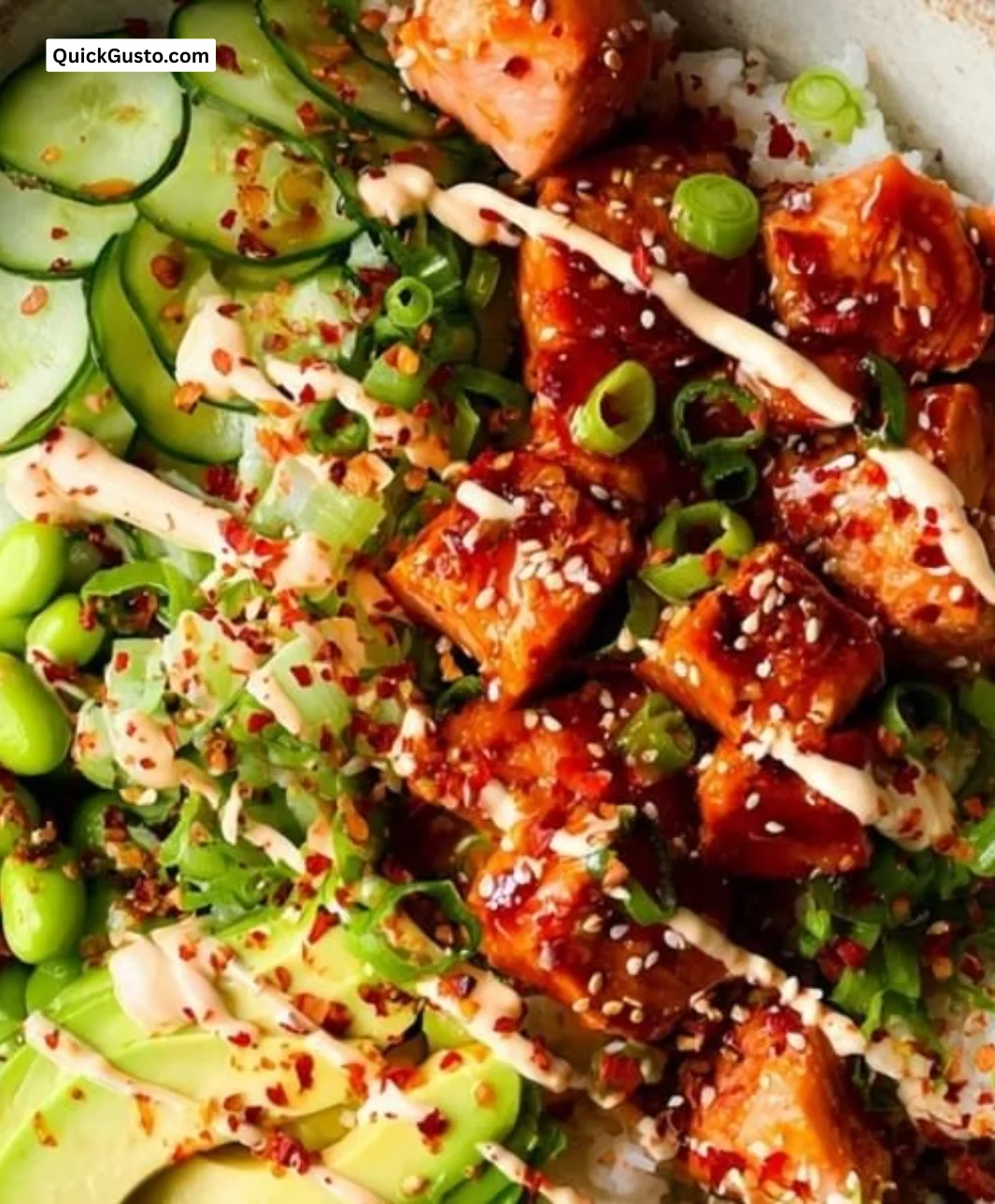 Delicious honey sriracha salmon bowls topped with fresh vegetables.