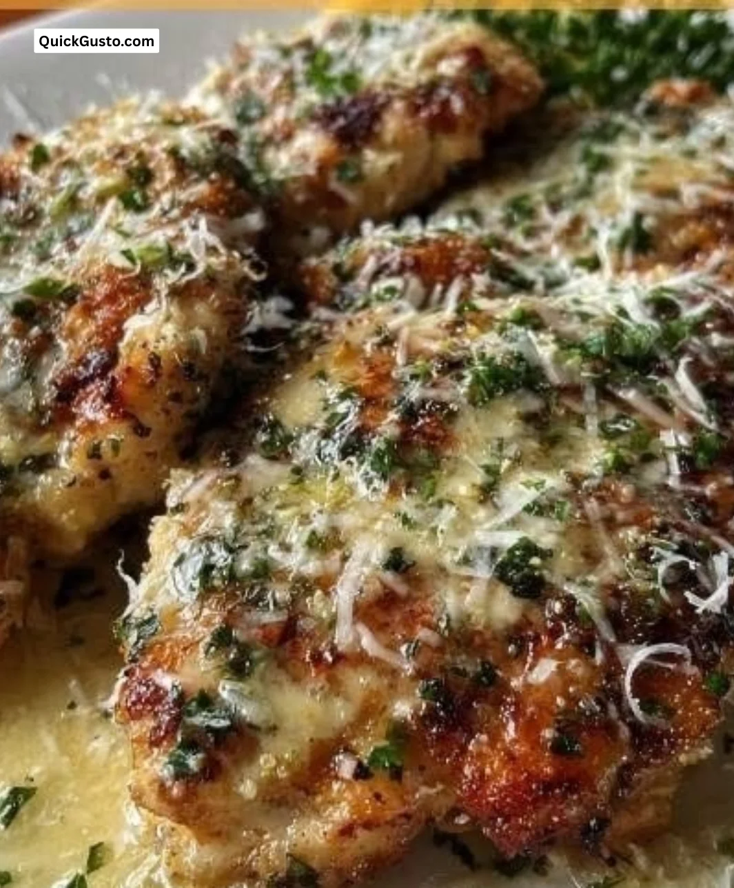 Lemon Chicken Romano dish garnished with fresh herbs and lemon slices