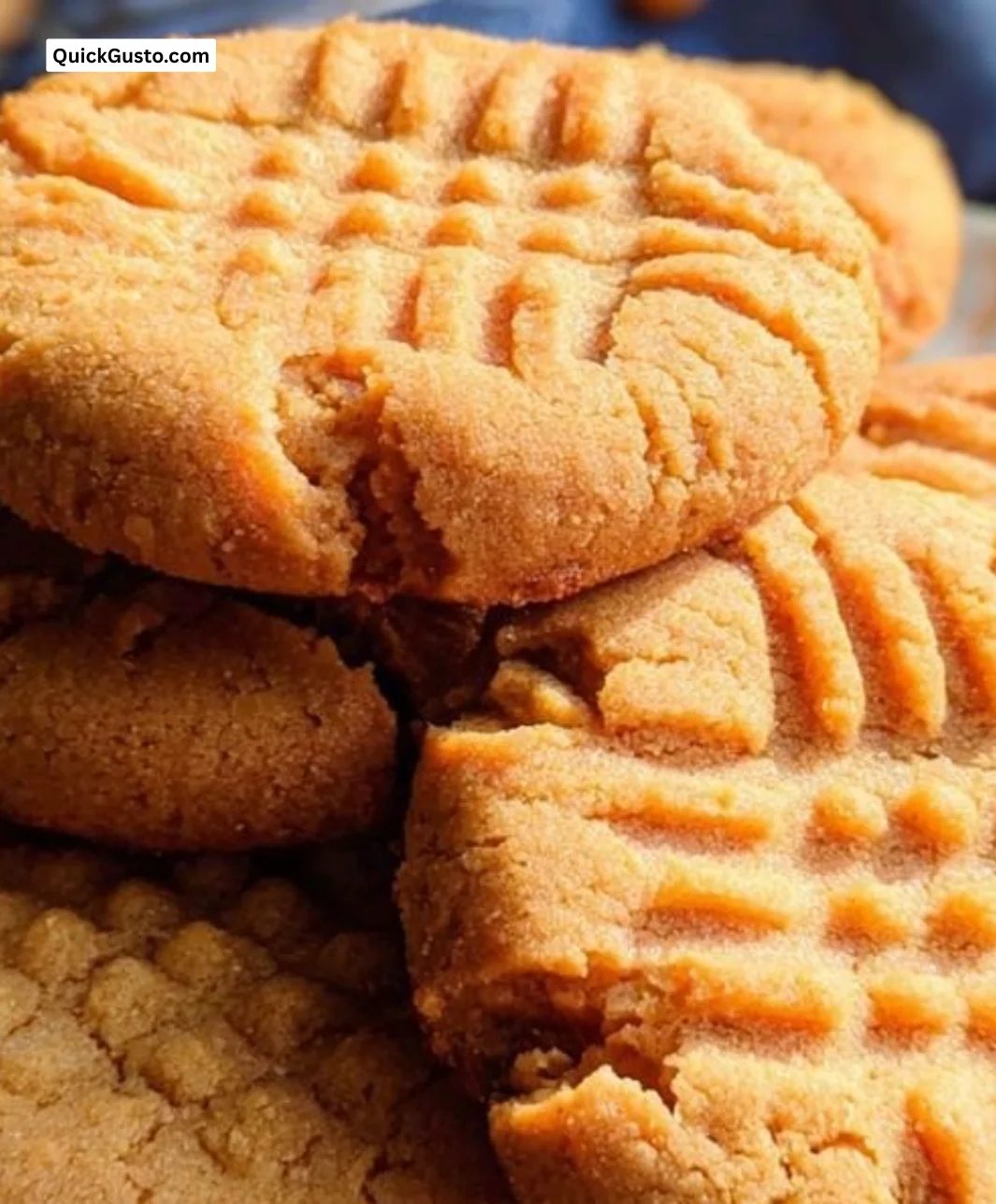 Homemade old-fashioned peanut butter cookies on a cooling rack.