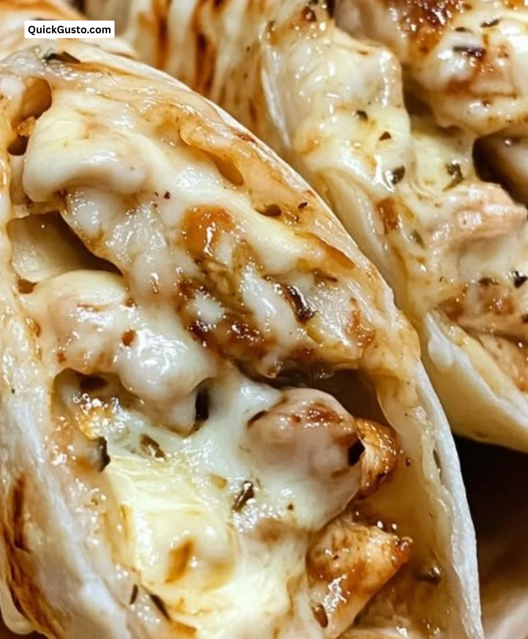 Cheesy garlic chicken wraps filled with gooey cheese and flavorful garlic, crispy on the outside.