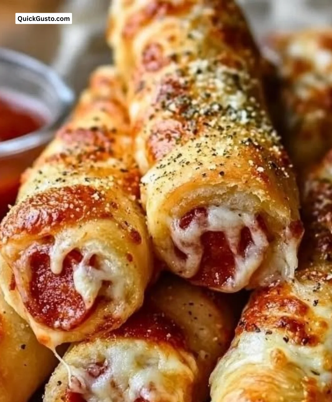 Pepperoni pizza roll breadsticks served on a plate, perfect for cozy dinners.