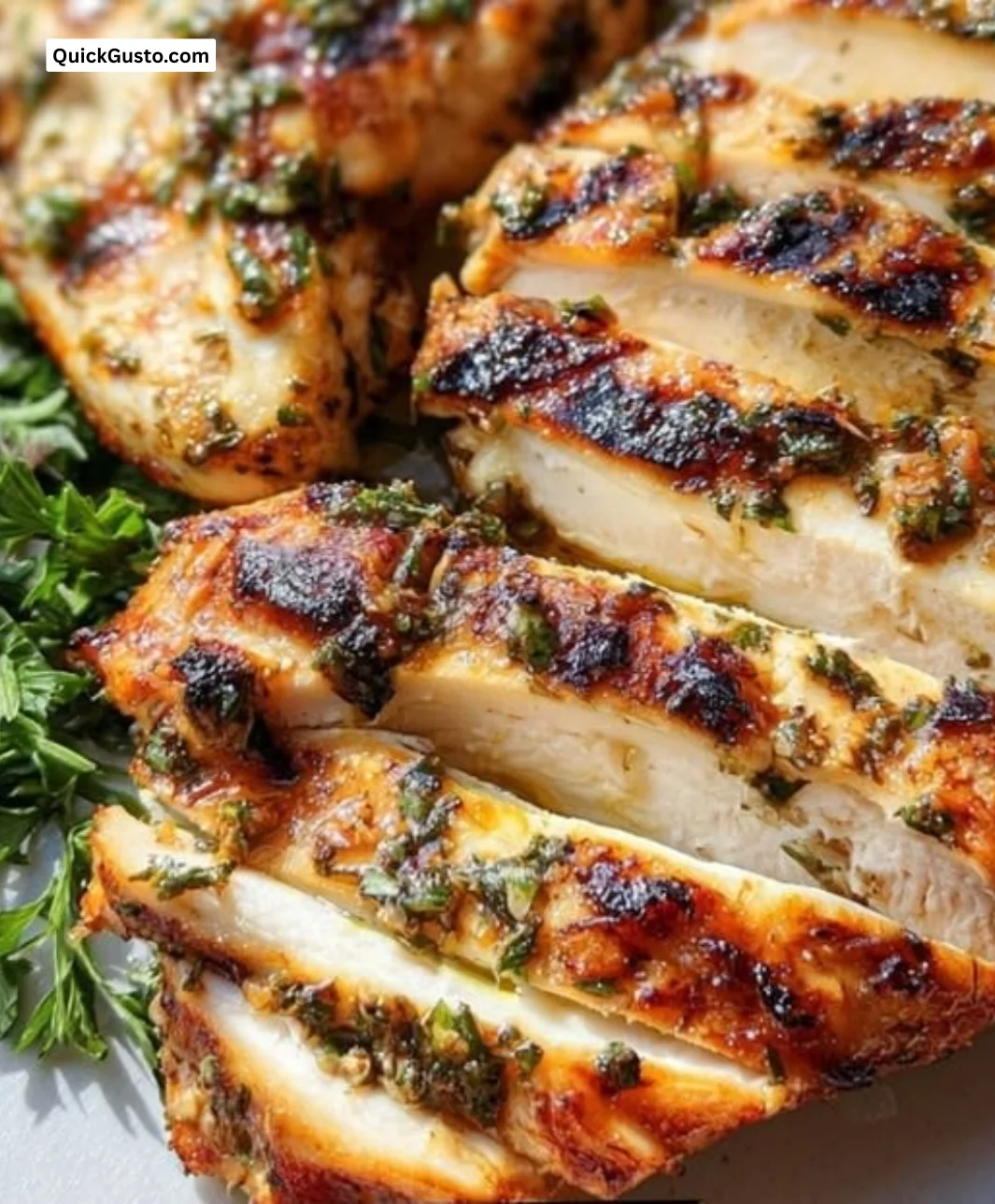 Perfectly grilled chicken breast garnished with herbs and served on a plate.