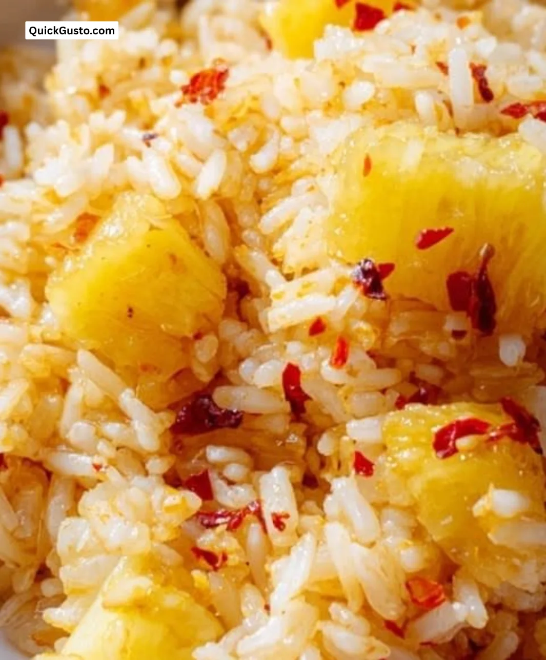 Bowl of flavorful pineapple rice garnished with fresh herbs