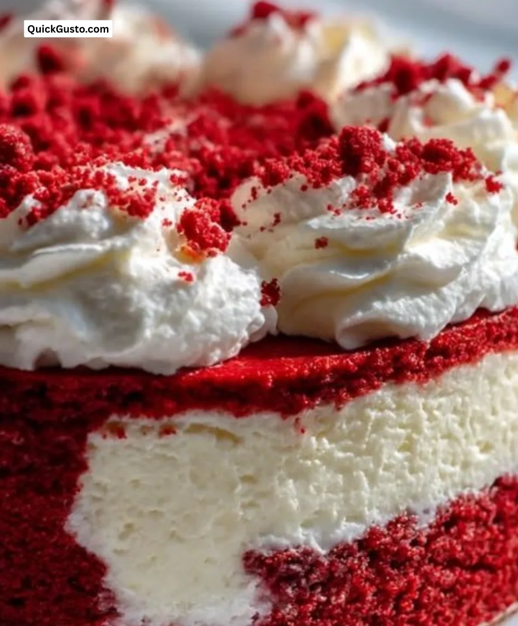 Delicious Red Velvet Cheesecake topped with cream cheese frosting