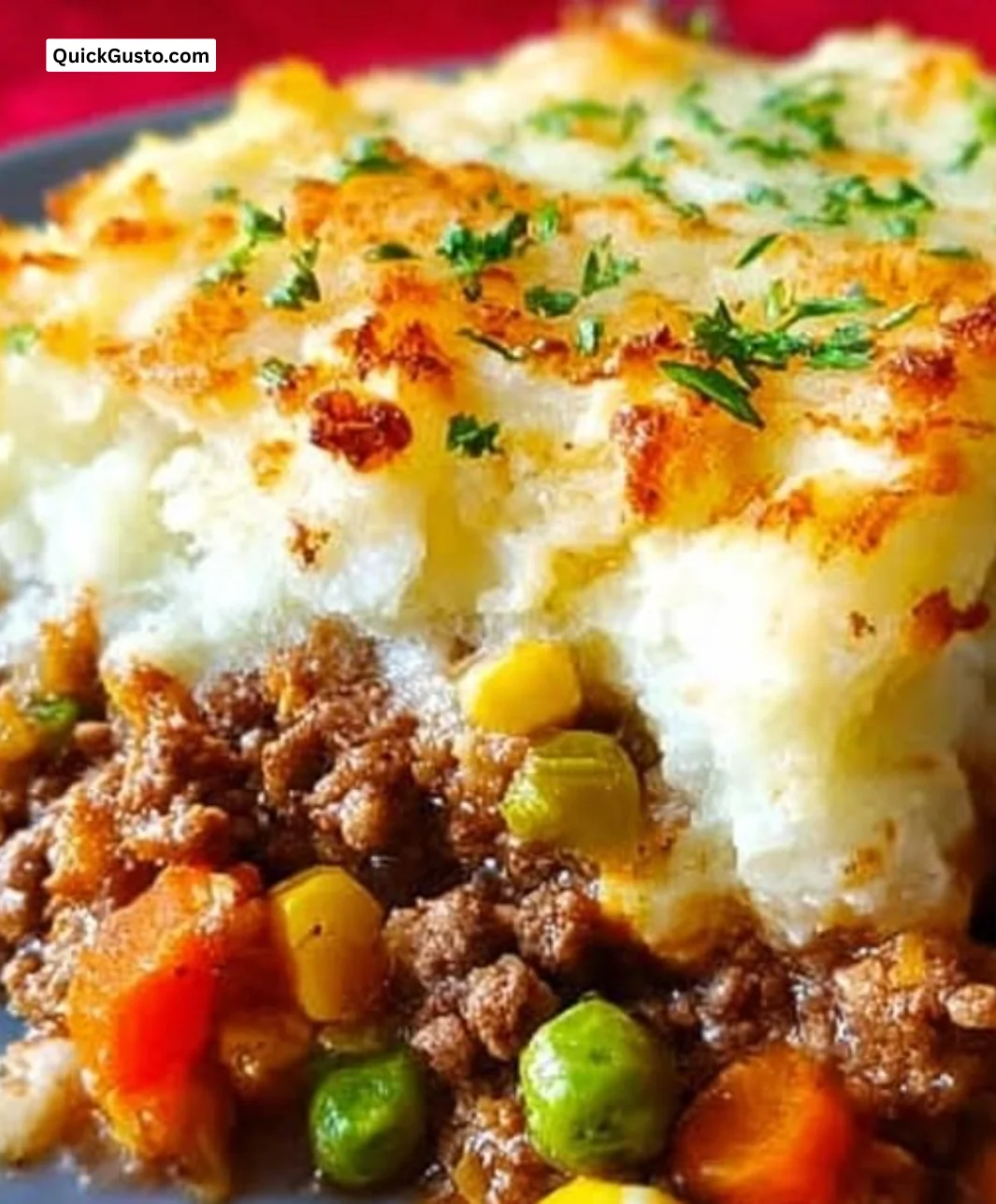 Delicious shepherd's pie topped with creamy mashed potatoes and fresh herbs.