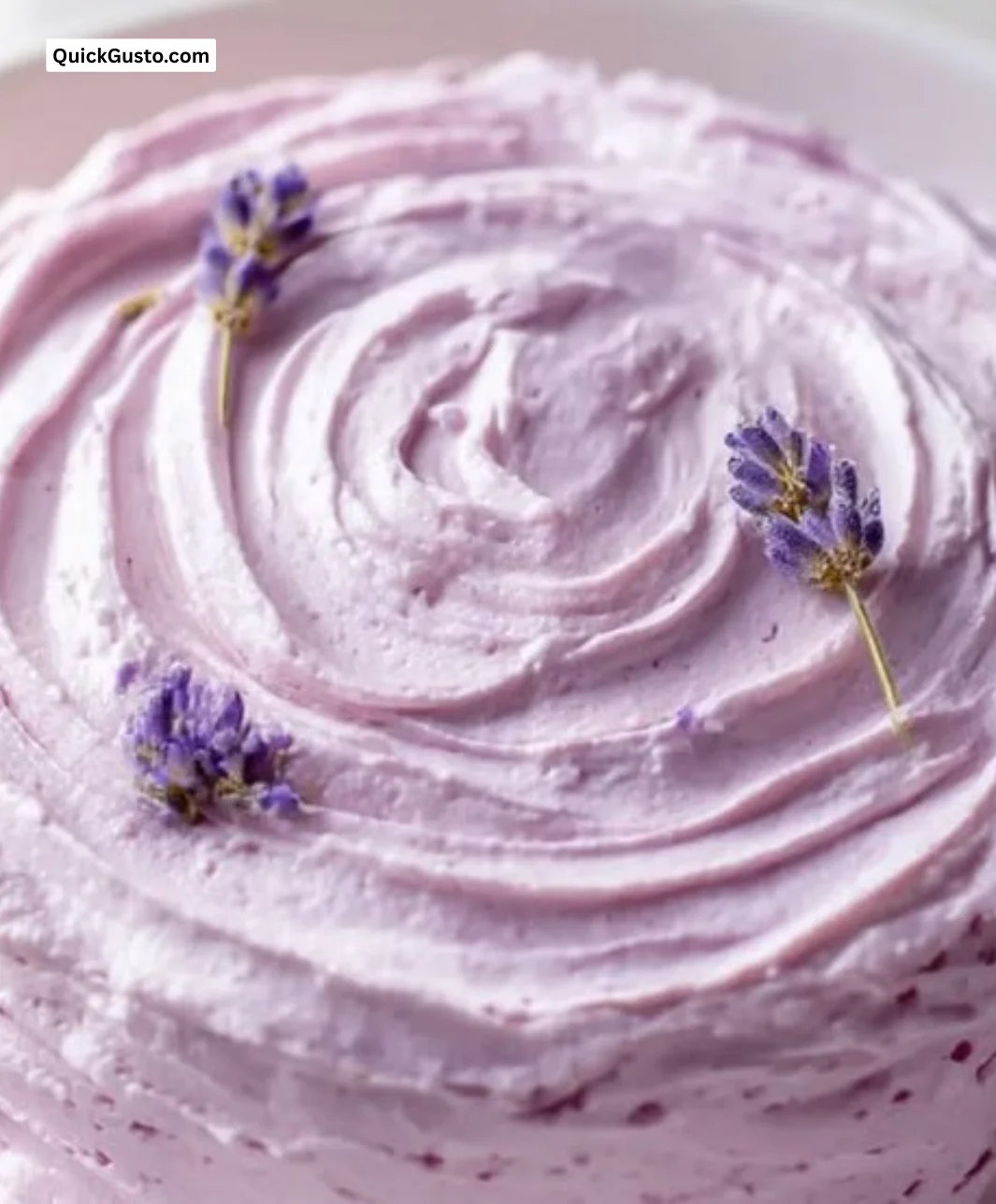 Silky smooth lavender buttercream frosting on a cake