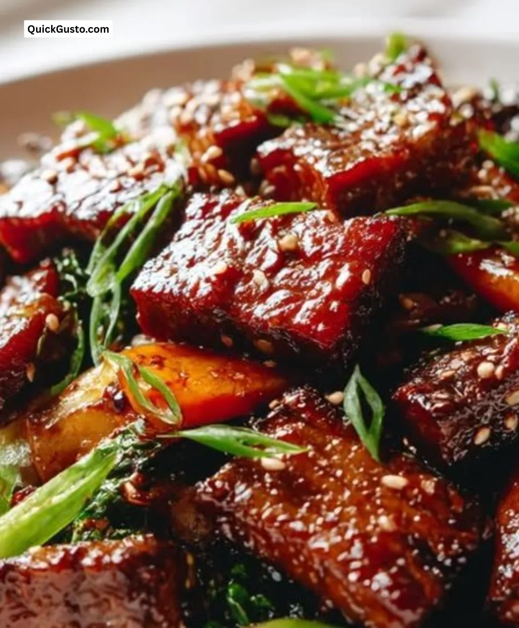 Spicy Korean Beef Belly Stir-Fry served with vegetables on a plate