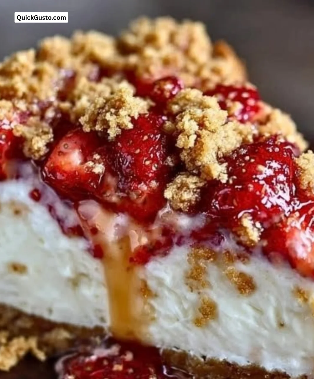 Delicious Strawberry Crunch Cheesecake topped with fresh strawberries and crunchy crumbs