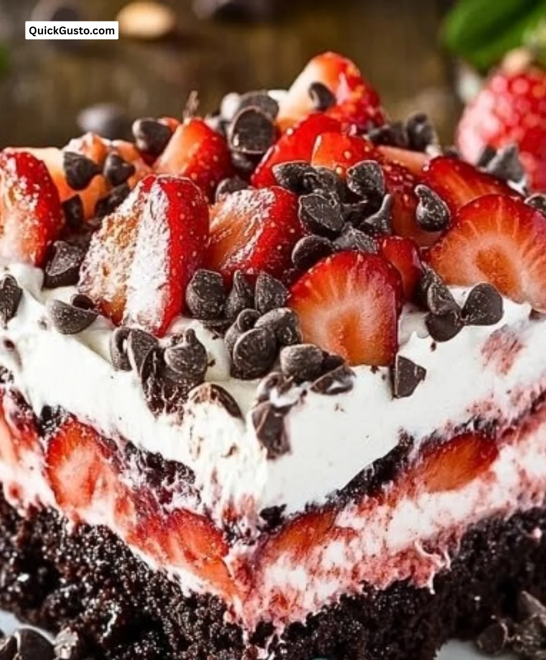 Strawberry Earthquake Cake with cream topping and fresh strawberries