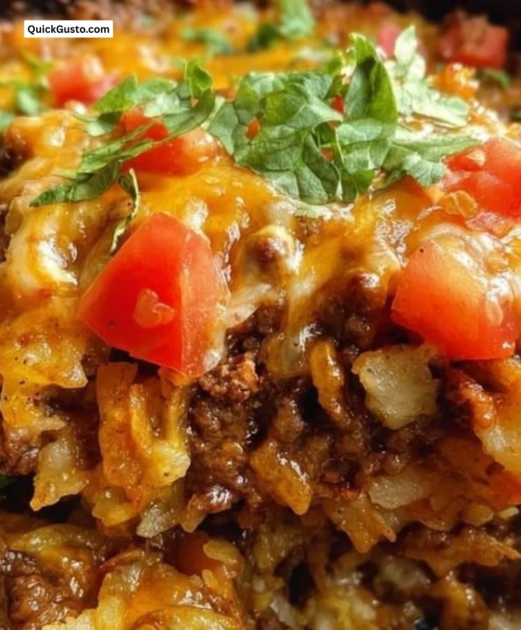 Taco Hashbrown Casserole in a crock pot with cheese and toppings