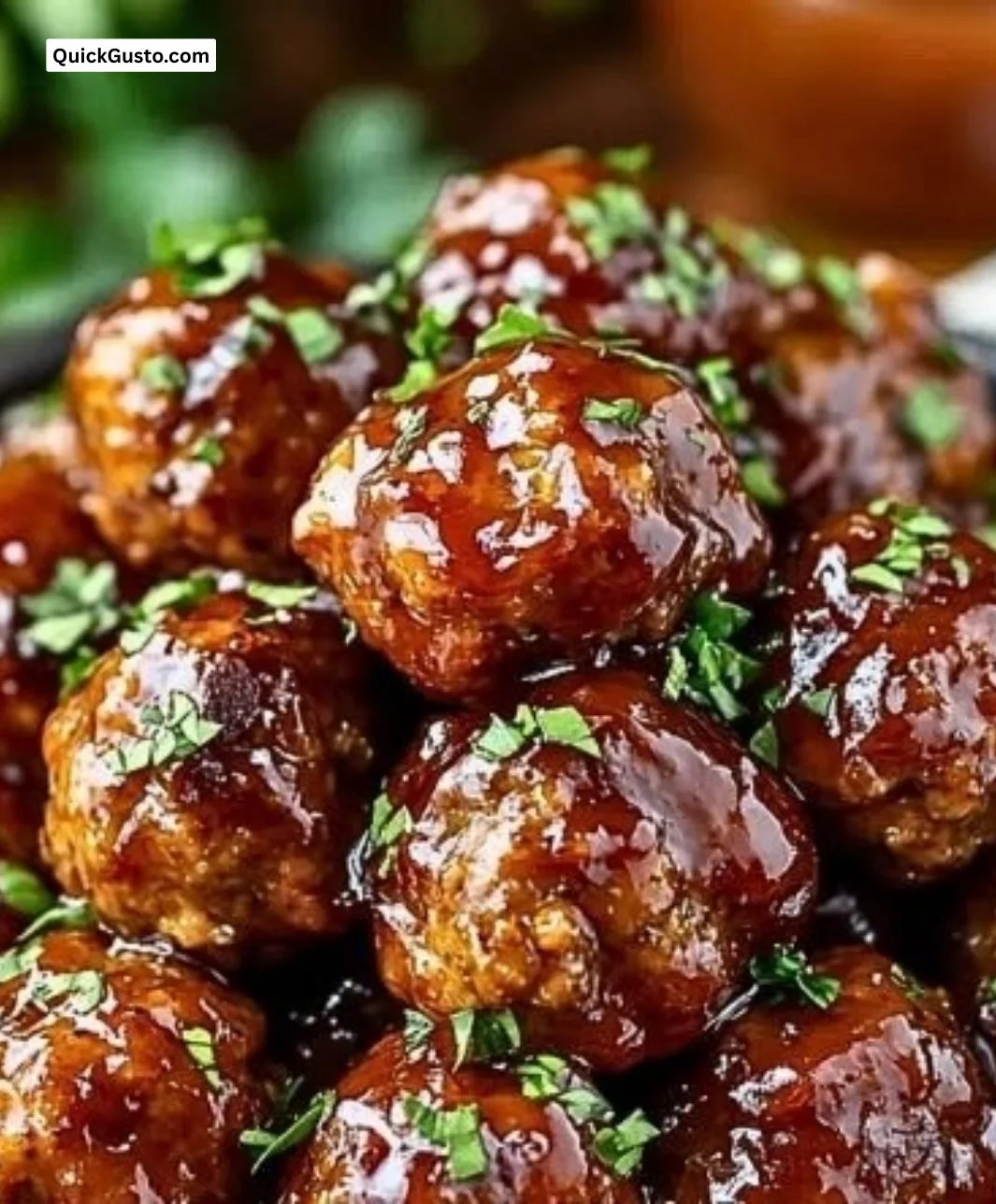 Whiskey Peach BBQ Meatballs served on a plate, garnished and ready to enjoy.