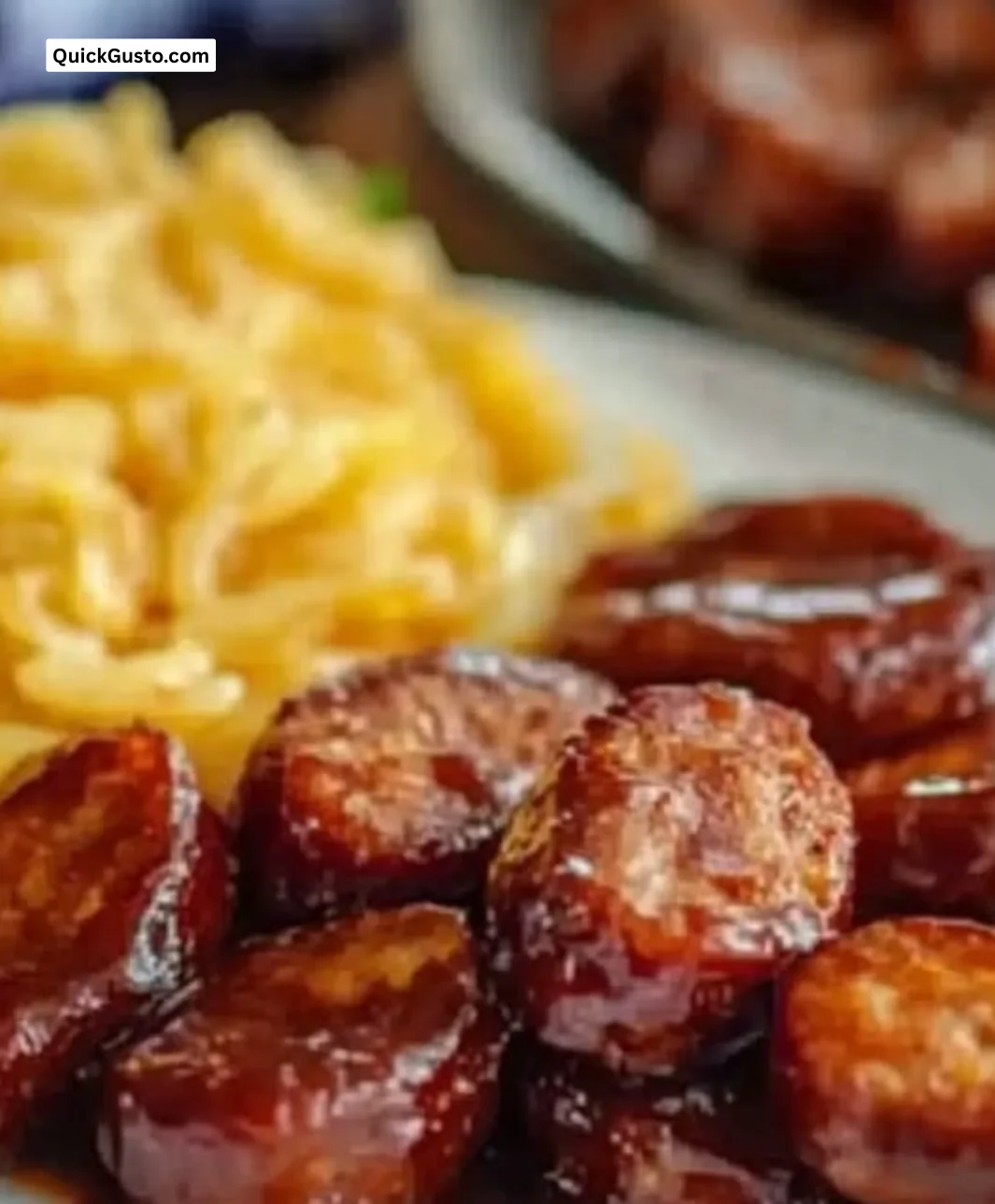 Plate of Baked BBQ Sausage served with sides, perfect for weeknight meals.