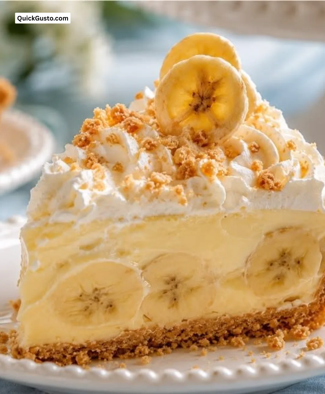 Delicious Banana Pudding Cheesecake topped with whipped cream and banana slices