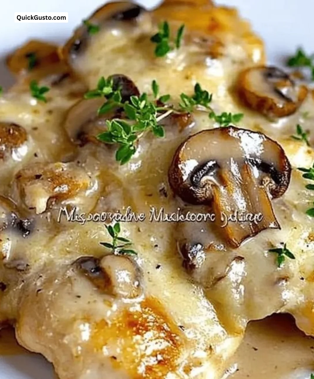 Creamy mushroom asiago chicken dish served with herbs and garnishes