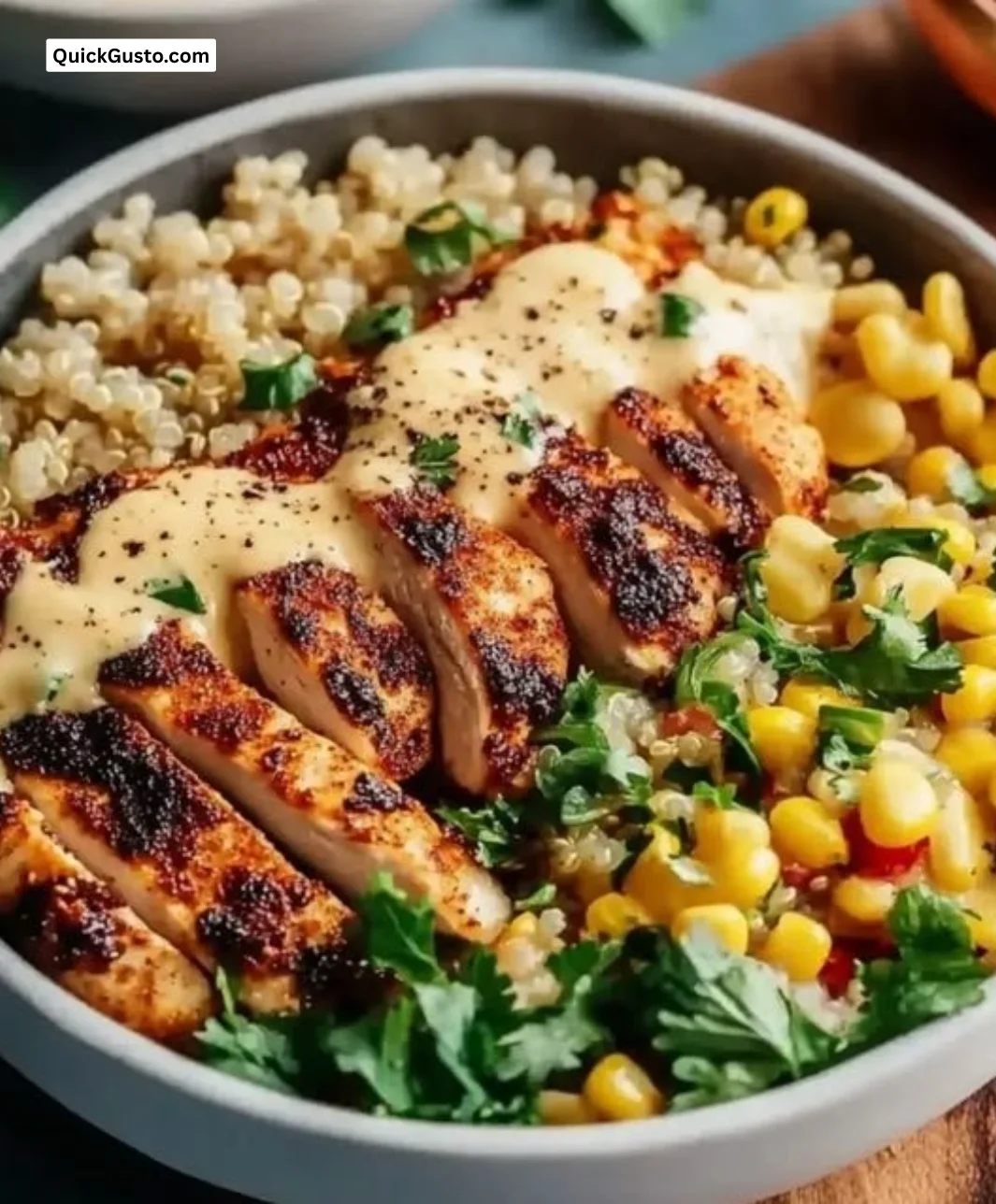 Delicious Chicken Quinoa Dinner Bowl topped with fresh vegetables