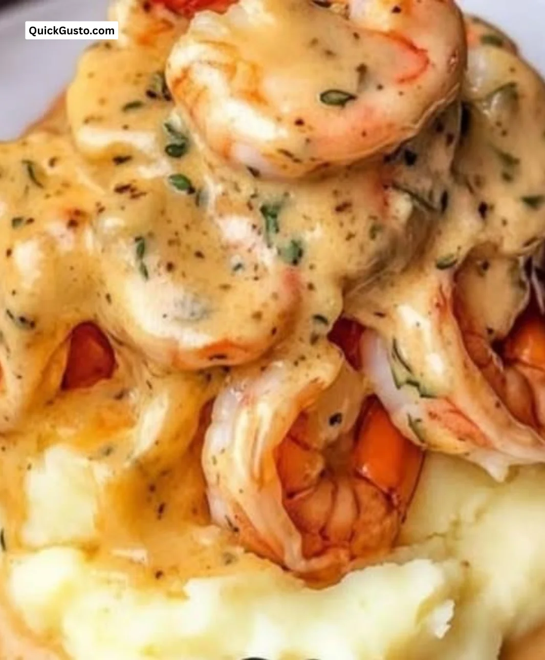 Plate of creamy garlic shrimp served over fluffy mashed potatoes