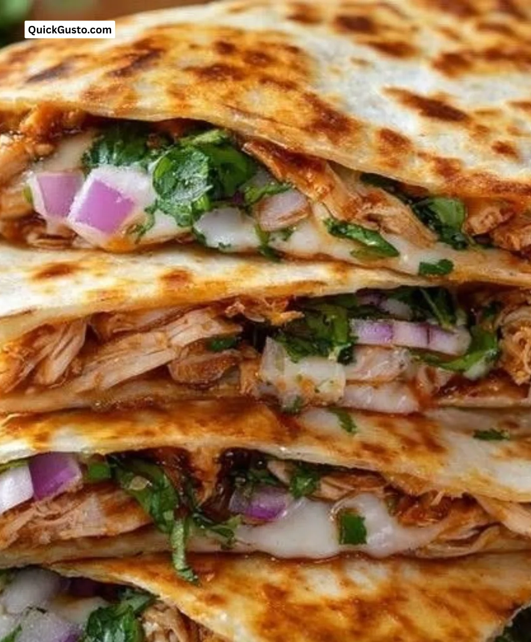 Delicious BBQ chicken quesadillas served on a plate with dipping sauce