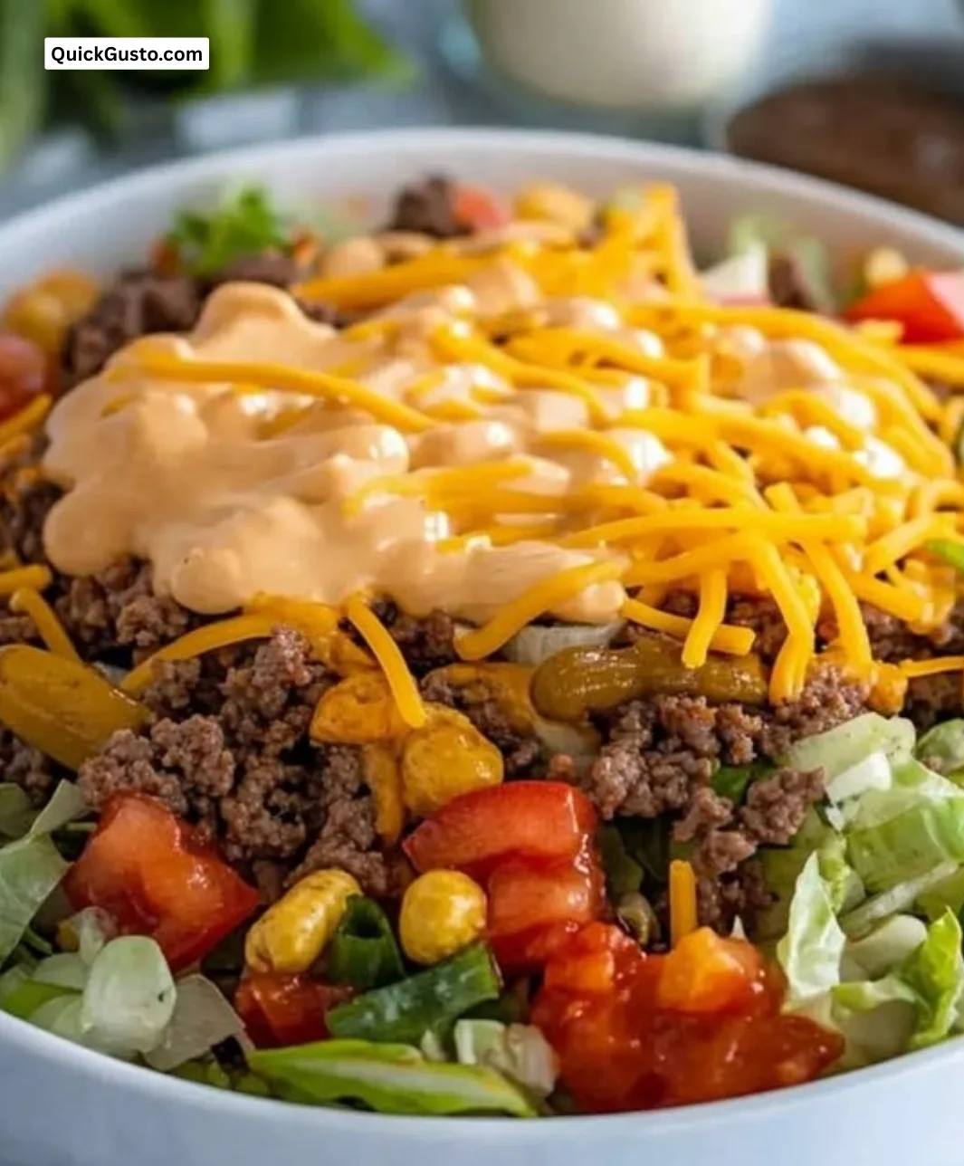 Big Mac Bowl filled with layers of ground beef, cheese, lettuce, and pickles