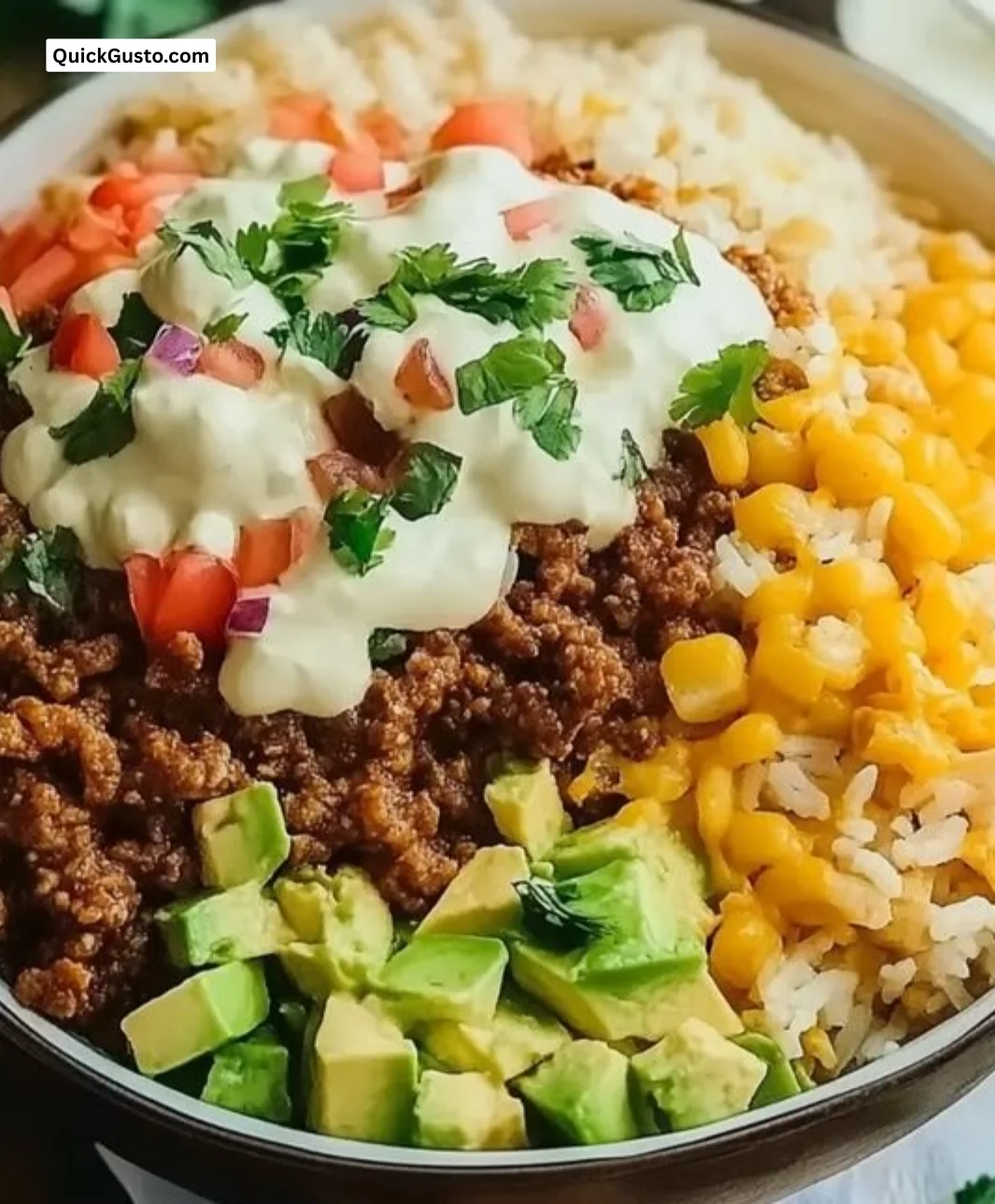 Delicious taco rice bowl topped with fresh ingredients and spices.